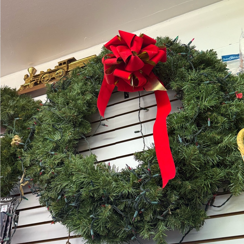 Festive Green Holiday Wreath with Red Bow